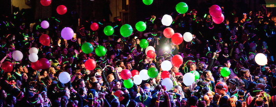 photo young people partying with balloons in the air 