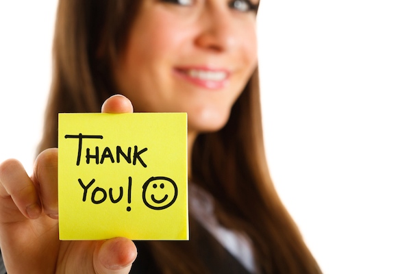 Woman holding thank you note